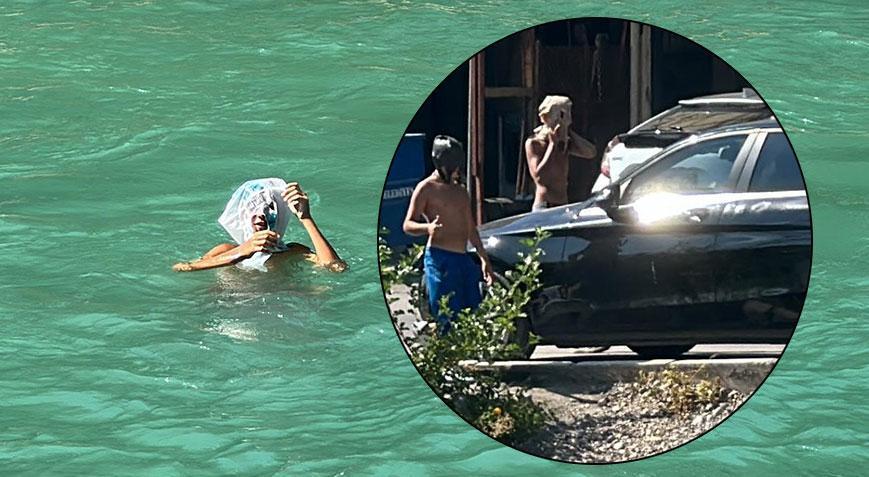 Yasağa rağmen çocuklar, başlarına kese kağıdı ve poşet geçirip yüzdü